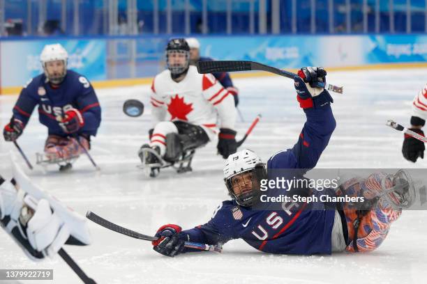Malik Jones of Team United States shoots against Canada in the third period during the Para Ice Hockey Preliminary Round match between United States...