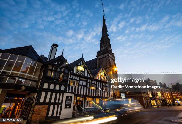 trinity church and roebuck hotel & pub (1626) on derby street of leek in staffordshire moorlands, england - mock tudor stock pictures, royalty-free photos & images