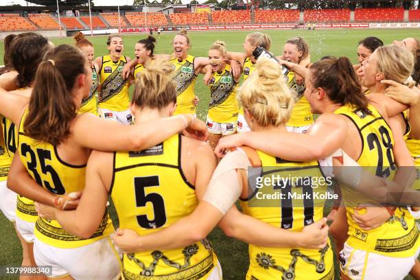 The Tigers celebrate victory during the round nine AFLW match between the Greater Western Sydney Giants and the Richmond Tigers at GIANTS Stadium on...