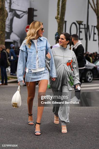 Guest wears sunglasses, a white t-shirt, a blue faded denim with silver nailed / studded sleeves jacket, a matching blue faded with silver nailed /...