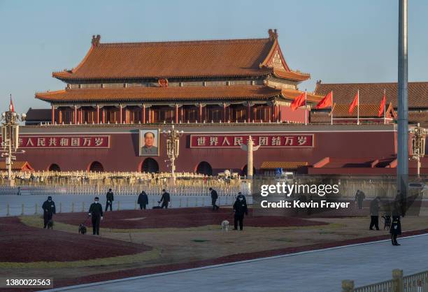 Police dog sniffing unit and explosive detection team do a security sweep in Tiananmen Square before the opening session of the National Peoples...