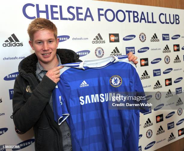 Newly announced Chelsea FC signing Kevin De Bruyne holds up his new shirt at the Cobham Training ground on January 31, 2012 in Cobham, England.