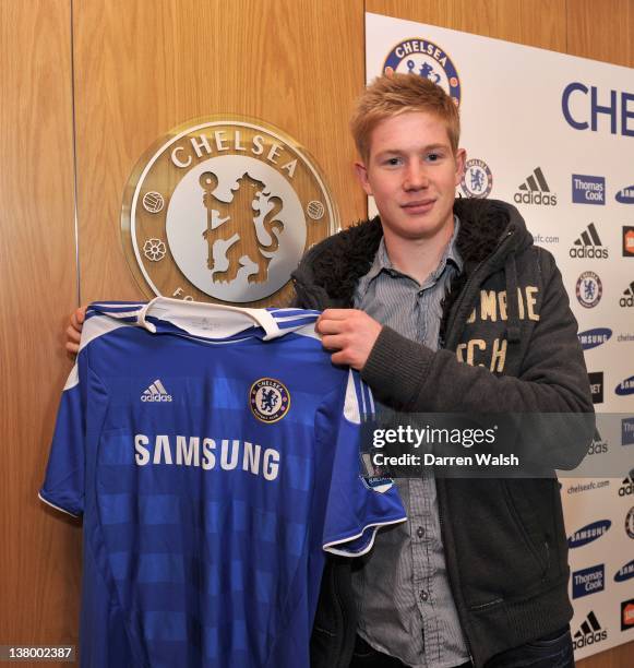 Newly announced Chelsea FC signing Kevin De Bruyne holds up his new shirt at the Cobham Training ground on January 31, 2012 in Cobham, England.