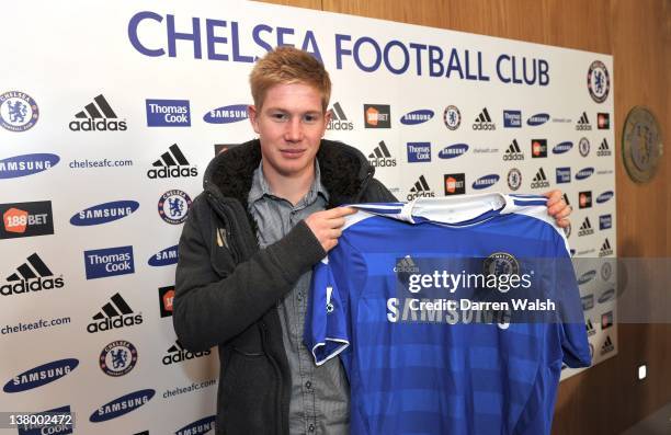 Newly announced Chelsea FC signing Kevin De Bruyne holds up his new shirt at the Cobham Training ground on January 31, 2012 in Cobham, England.