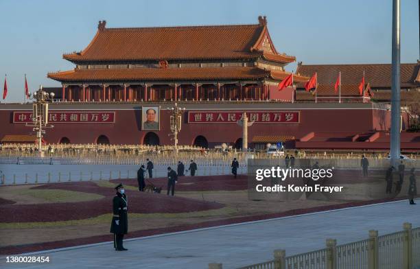 Police dog sniffing unit and explosive detection team do a security sweep in Tiananmen Square before the opening session of the National Peoples...