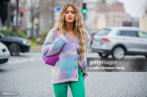 Emili Sindlev seen wearing batik cardigan, green pants, pink Loewe bag, heels outside Loewe during Paris Fashion Week - Womenswear F/W 2022-2023 on...