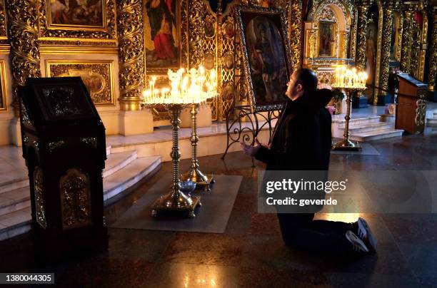 praying for peace at church in kiev - ukrainian angel stock pictures, royalty-free photos & images