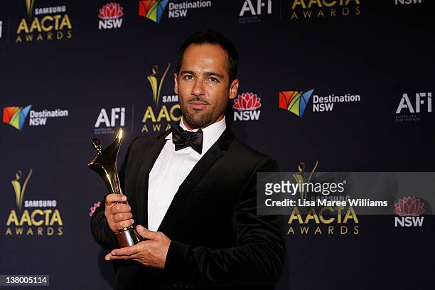 Australian actor Alex Dimitriades poses with his AACTA Award for Best Lead Actor in a Television Drama for his role in The Slap at the 2012 AACTA...