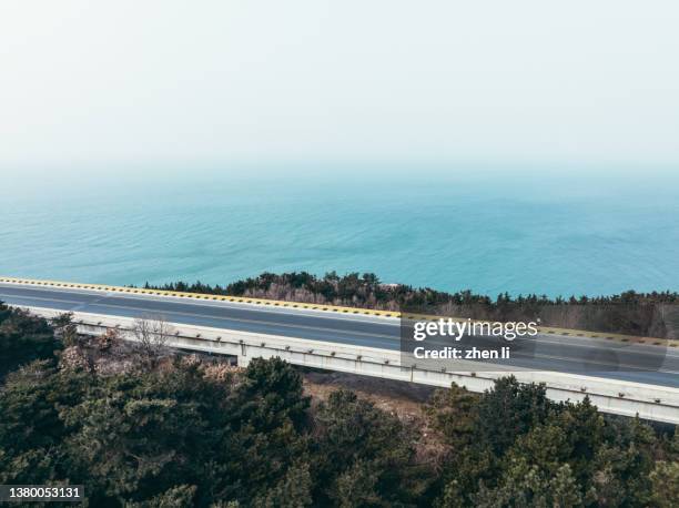 aerial view of coastal road - coastal road stock pictures, royalty-free photos & images