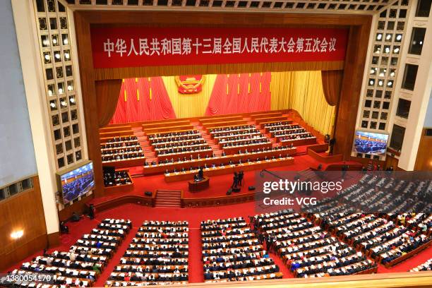 Deputies attend the opening meeting of the fifth session of the 13th National People's Congress at the Great Hall of the People on March 5, 2022 in...