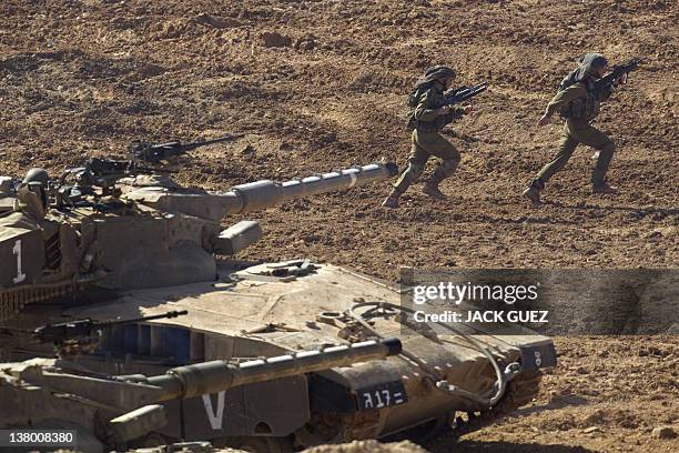 Israeli soldiers take part in an exercise at the Shizafon army base, in the Negev Desert north of the southern city of Eilat, on January 31, 2012....