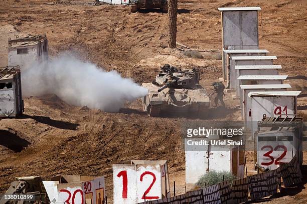 An Israeli Merkava tank takes position in a mock city during an army exercise on at the Shizafon army base, in the Negev Desert north of the southern...