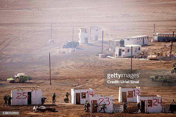Israeli soldiers take part in an army exercise on at the Shizafon army base, in the Negev Desert north of the southern city of Eilat on January 31,...