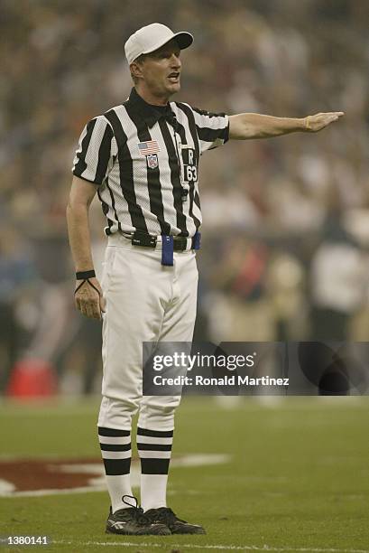 Referee Bill Carollo calls a penalty during the NFL game between the Dallas Cowboys and the Houston Texans on September 8, 2002 at Reliant Stadium in...