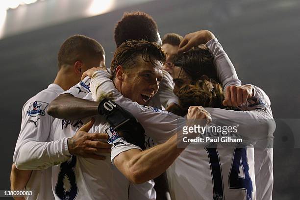 Scott Parker of Spurs celebrates with team mates after Luka Modric of Spurs scores their second goal during the Barclays Premier League match between...