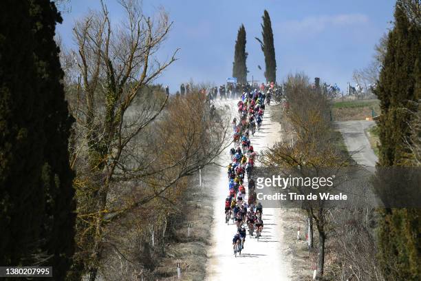 The peloton passing through a gravel strokes sector during the Eroica - 16th Strade Bianche 2022 - Men's Elite a 184km one day race from Siena to...