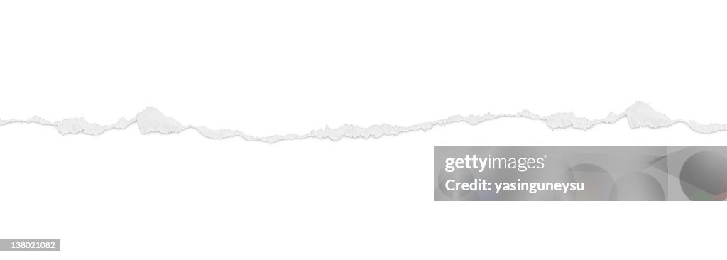 Gray tear across white background