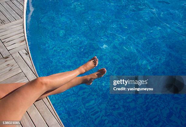 poolside - legs crossed at knee stock pictures, royalty-free photos & images