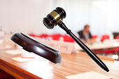 justice gavel and block with courtroom background