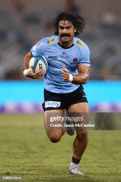 Charlie Gamble of the Waratahs runs the ball during the round three Super Rugby Pacific match between the ACT Brumbies and the NSW Waratahs at GIO...
