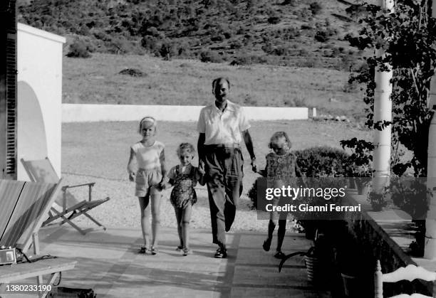 Grand Duke Otto von Habsburg with three of his daughters during a holiday, Benidorm, Alicante, Spain, 1963.