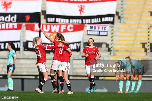 Martha Thomas of Manchester United celebrates with teammates after scoring their side's first goal during the Barclays FA Women's Super League match...