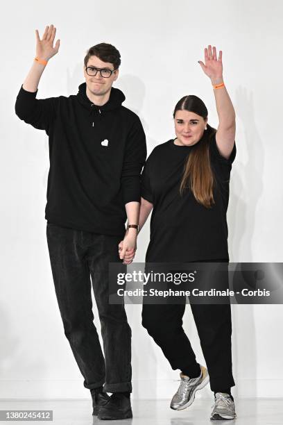 Fashion designers Balthazar Delepierre and Ester Manas walk the runway during the Ester Manas Womenswear Fall/Winter 2022-2023 show as part of Paris...