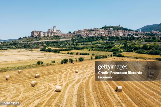 italy, umbria, perugia district, assisi, basilica of san francesco, hay bales - saint francis of assisi stock pictures, royalty-free photos & images