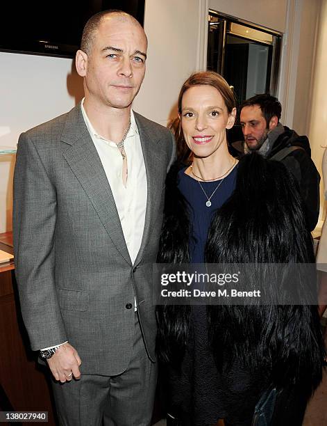 Dinos Chapman and Tiphaine de Lussy attend a private viewing of "Gaucho", a photographic exhibition by Astrid Munoz, at the Jaeger-LeCoultre Boutique...