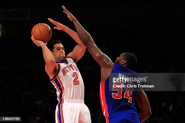 Landry Fields of the New York Knicks shoots over Jason Maxiell of the Detroit Pistons at Madison Square Garden on January 31, 2012 in New York City....