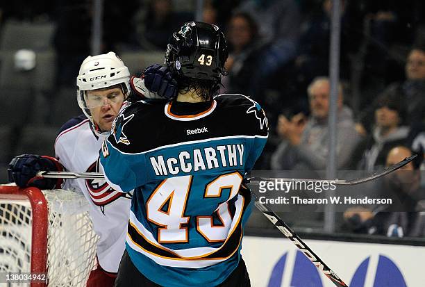 Aaron Johnson of the Columbus Blue Jackets gets a ten minute misconduct penalty for fighting with John McCarthy of the San Jose Sharks in the third...