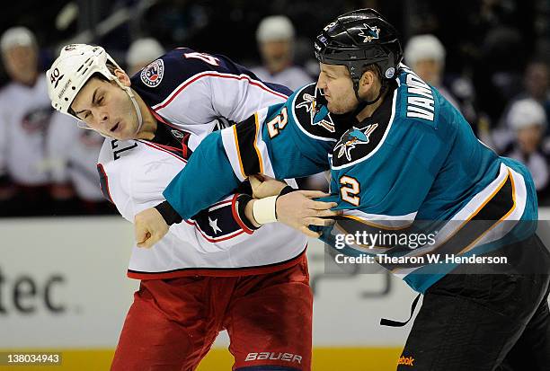 Jim Vandermeer of the San Jose Sharks exchanges punches with Jared Boll of the Columbus Blue Jackets for a second time during an NHL hockey game at...