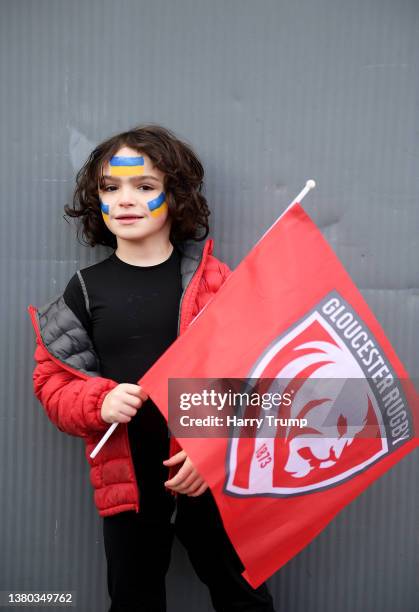 Fan poses with their face painted in the colours of the Ukraine flag to indicate peace and sympathy with Ukraine ahead of the Gallagher Premiership...