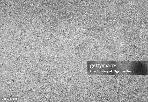 washed sand floor, black stone grains rough surface texture material background - concrete floor stock-fotos und bilder