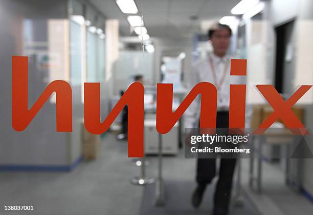 An employee of Hynix Semiconductor Inc. Walks through the company's office in Seoul, South Korea, on Wednesday, Feb. 1, 2012. Hynix Semiconductor...