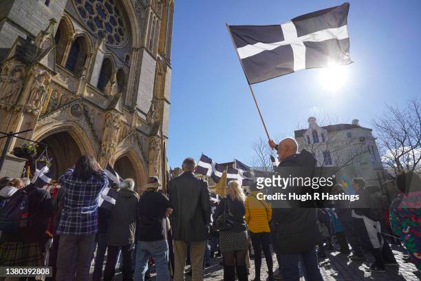 Cornishman flies the flag of St Piran during community singing on the steps of Truro Cathedral as the Cornish celebrate St Piran's Day on March 05,...