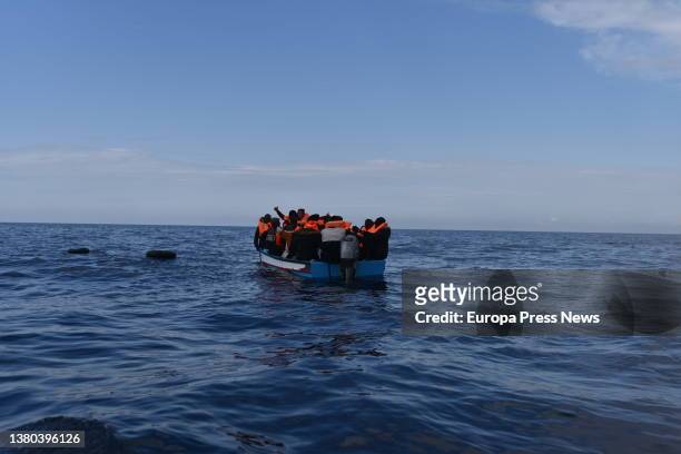 Migrants in a wooden boat, which left the coast of Libya, are waiting to be rescued by members of the NGO Open Arms, March 5 off the coast of Libya,...