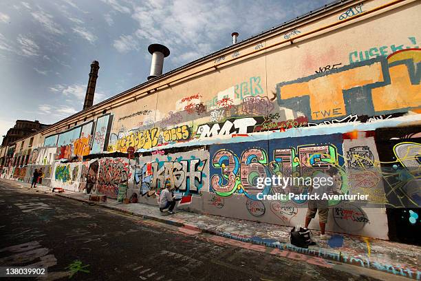 General view of graffiti street art covering the main wall of the old Central Bus station at Rue des Pyrenees on January 7, 2012 in Paris, France....