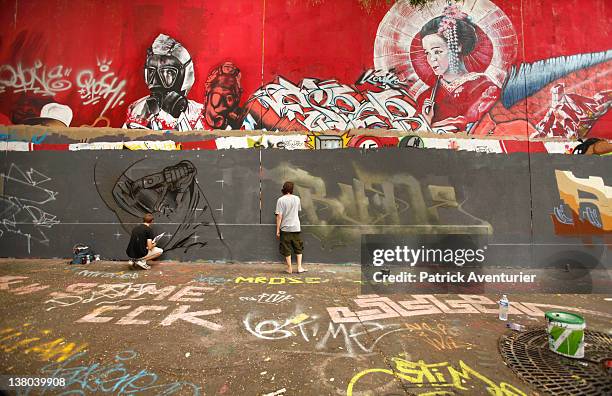 General view of graffiti street art covering the main wall of the old Central Bus station at Rue des Pyrenees on January 7, 2012 in Paris, France....