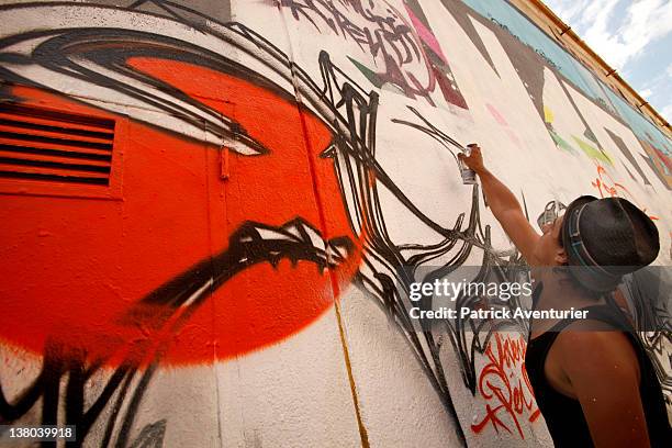 The graffiti artist "Mr one Teas".A general view of graffiti street art covering the main wall of the old Central Bus station at Rue des Pyrenees on...