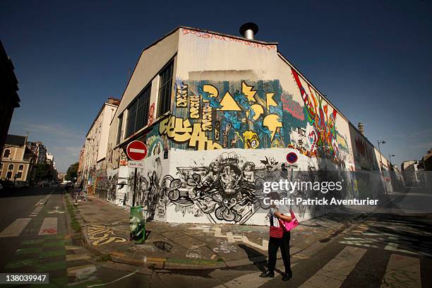 General view of graffiti street art covering the main wall of the old Central Bus station at Rue des Pyrenees on January 7, 2012 in Paris, France....