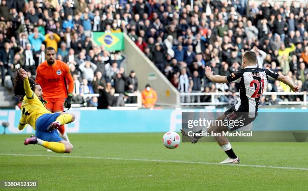 Ryan Fraser of Newcastle United scores their team's first goal during the Premier League match between Newcastle United and Brighton & Hove Albion at...