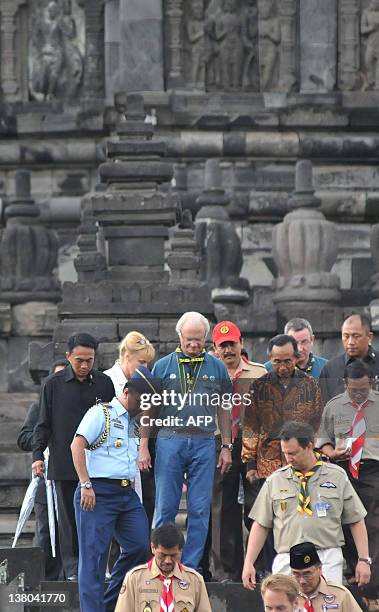 Swedish King Carl XVI Gustaf accompanied by Indonesian Youth and Sports Minister Andi Mallarangeng visits the ancient Prabanan Hindu temple in...