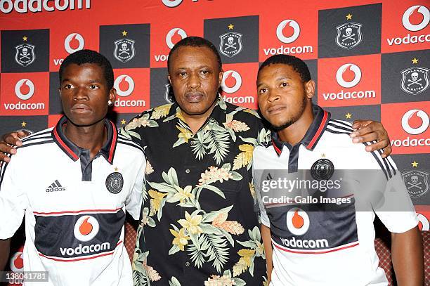 Irvin Khoza, Chairman of Orlando Pirates with new signings Sifiso Myeni and Thandani Ntshumayelo during the Orlando Pirates press conference at the...