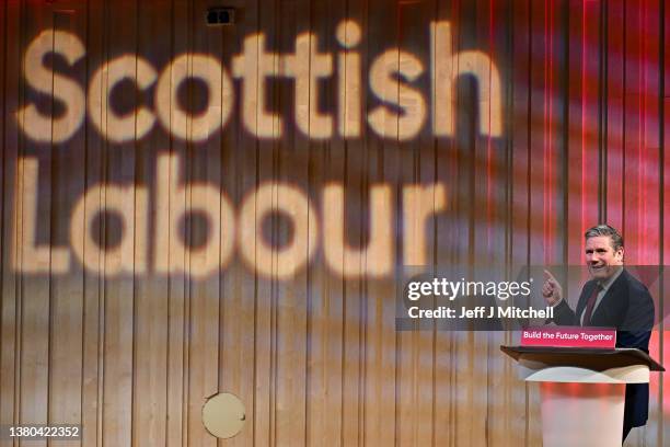 Leader of the Labour Party Keir Starmer addresses delegates from the stage during his keynote speech to the Scottish Labour Party Conference at the...