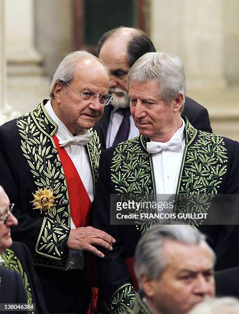 French film director and producer, Regis Wargnier talks with academician Marc Ladreit de Lacharrière during the Wargnier's official entry ceremony at...