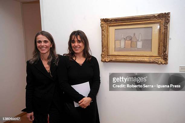 Cristina and Giuliana Pavarotti poses in front of their father Luciano's favourite picture at Morandi Museum on February 1, 2012 in Bologna, Italy....