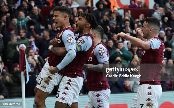 Philippe Coutinho of Aston Villa celebrates with teammates Tyrone Mings and Danny Ings after scoring their side's third goal during the Premier...