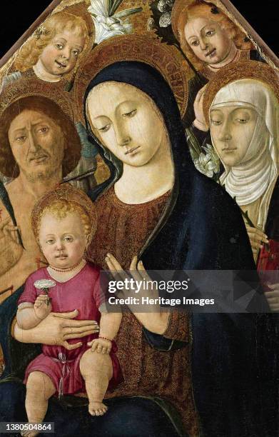 Madonna and Child with Saints Sebastian, Catherine of Siena and two angels, circa 1480. Found in the Collection of the Accademia Carrara, Bergamo....