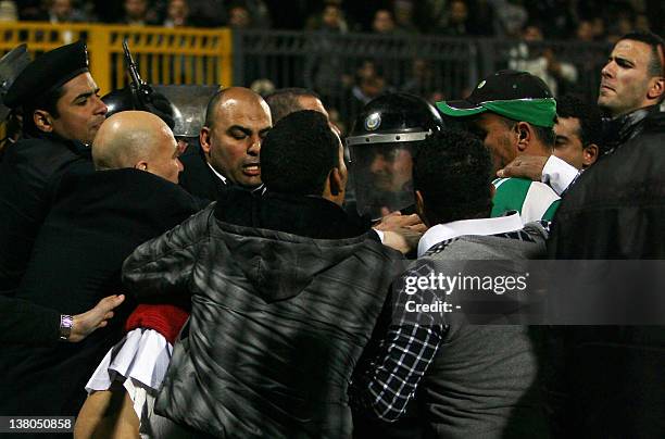 Egyptian police clash with fans after a football match between Al-Ahly and Al-Masry teams in Port Said, 220 kms northeast of Cairo, on February 1,...